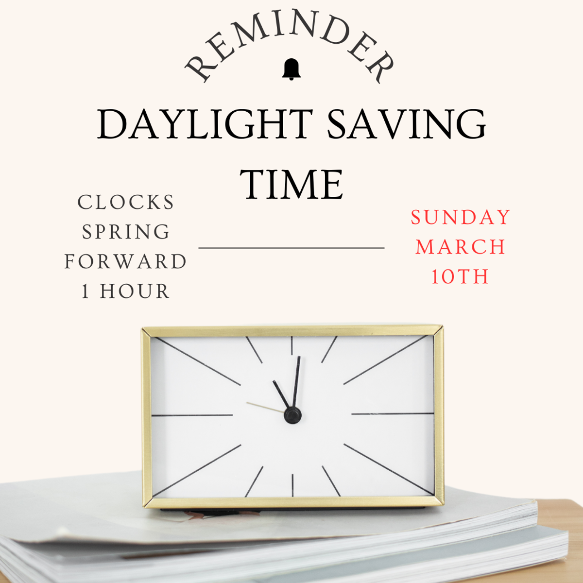 Analog clock sitting on top of two books with a reminder for daylight savings time above it. 