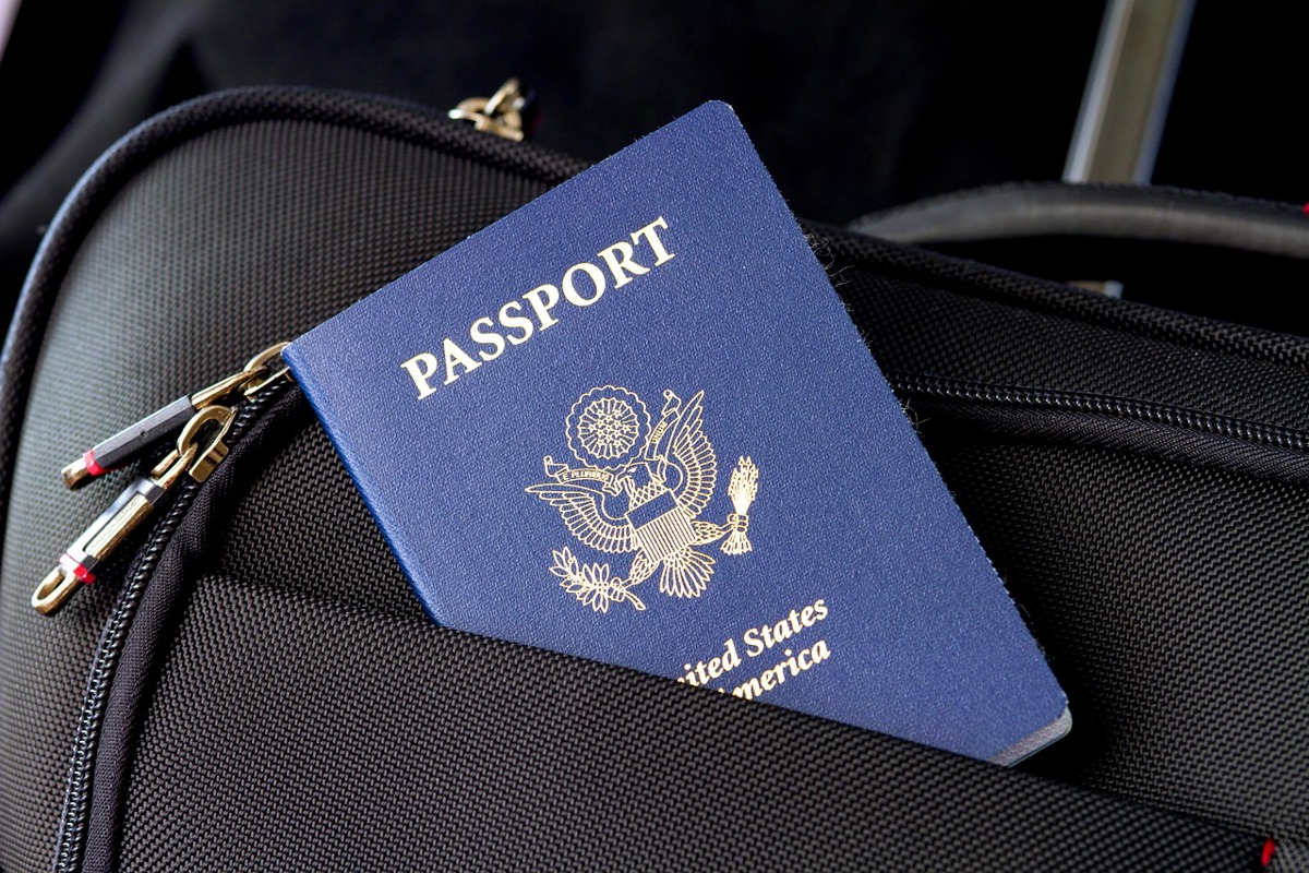A passport for the United States in a pocket of a bag. 