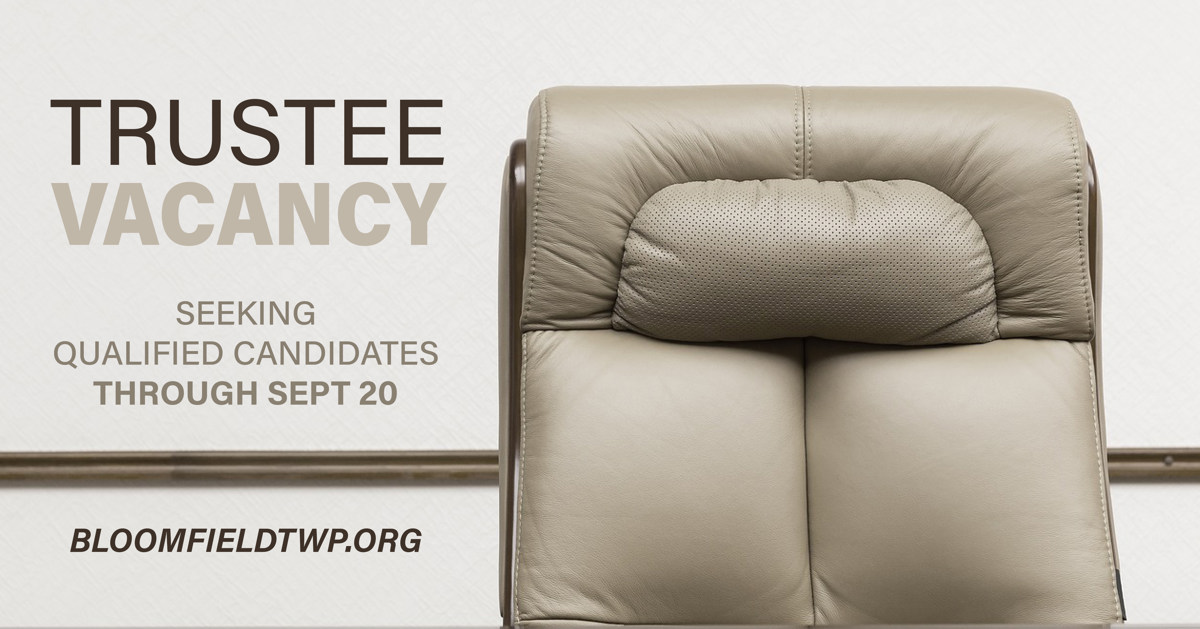 Lounge chair with the words "trustee vacancy" to the left. 