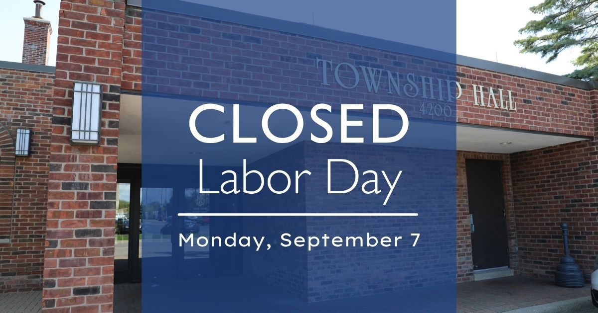 Entrance to Township Hall with notice that reads: Closed Labor Day Monday, September 7. Emergency services will remain in effect.
