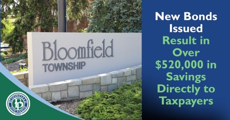 The Bloomfield Township gateway sign with message "New Bonds Issued Result in Over $520,000 in Savings Directly to Taxpayers"